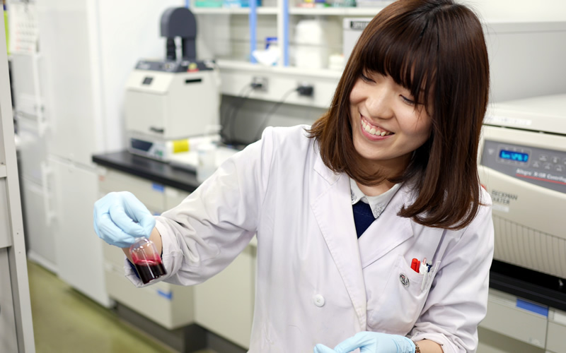 Kyoko Yokomaku, first year graduate student, smiles with the completed artificial blood product in her hand.